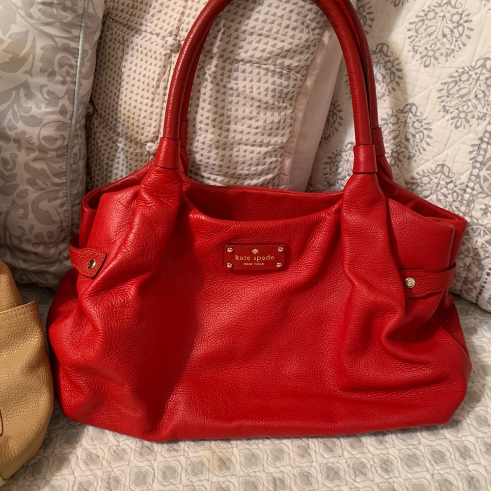 Beautiful red soft leather Kate spade tote no rips or worn marks ,,  clean